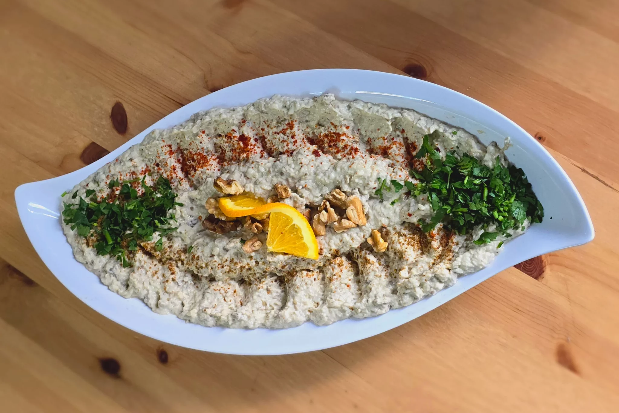 Staatsministerin Widmann-Mauz und Gäste genießen syrische Küche in Berlin